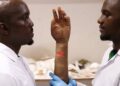 BMA Feature: Nigerian Brothers Pioneer Hyperrealistic Bionic Arm Tailored For Darker Skin Tones